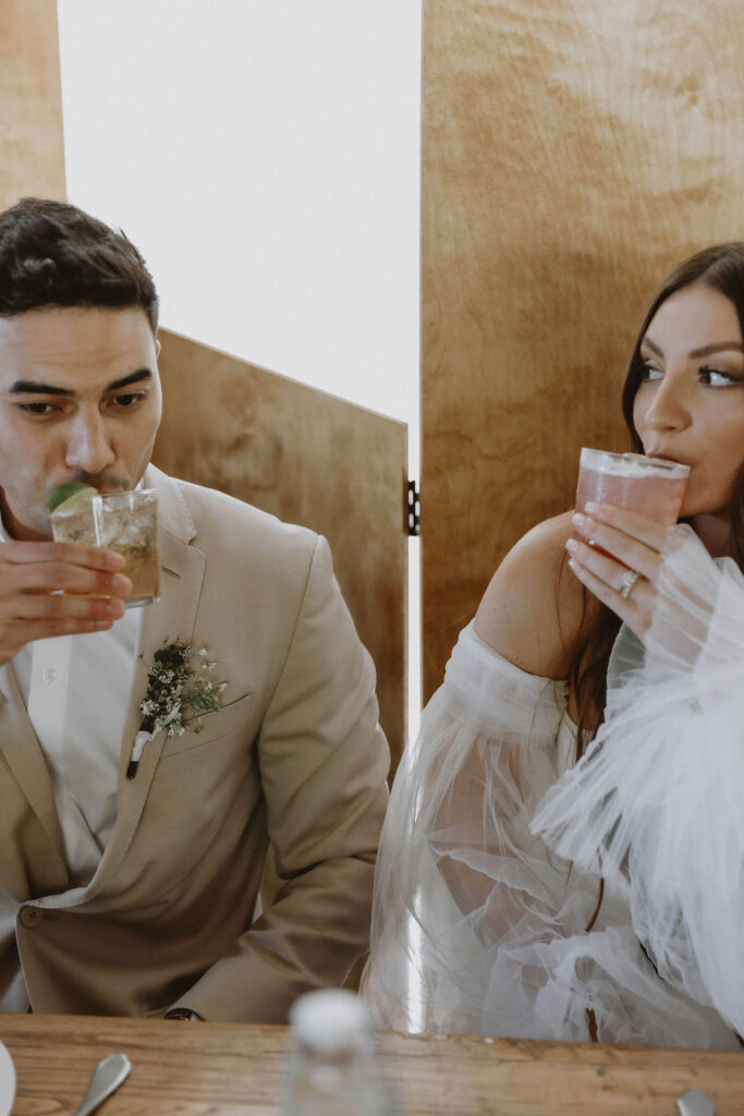 Bride and groom drinking
