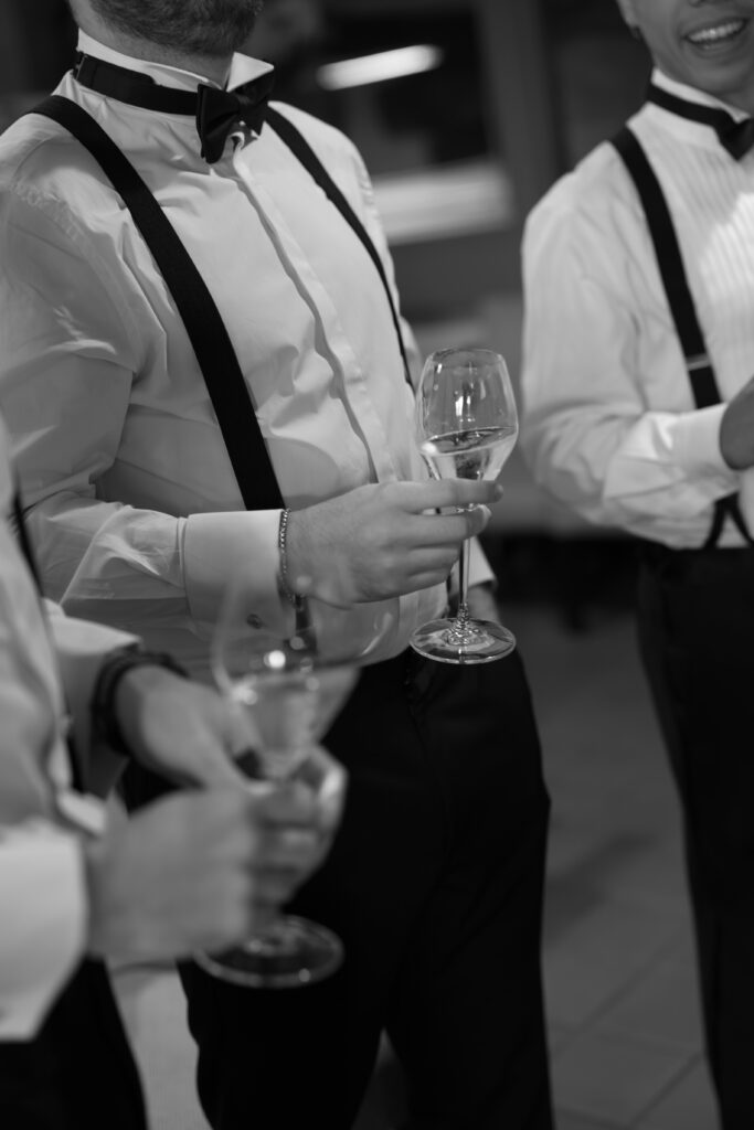 Groomsmen drinking during reception