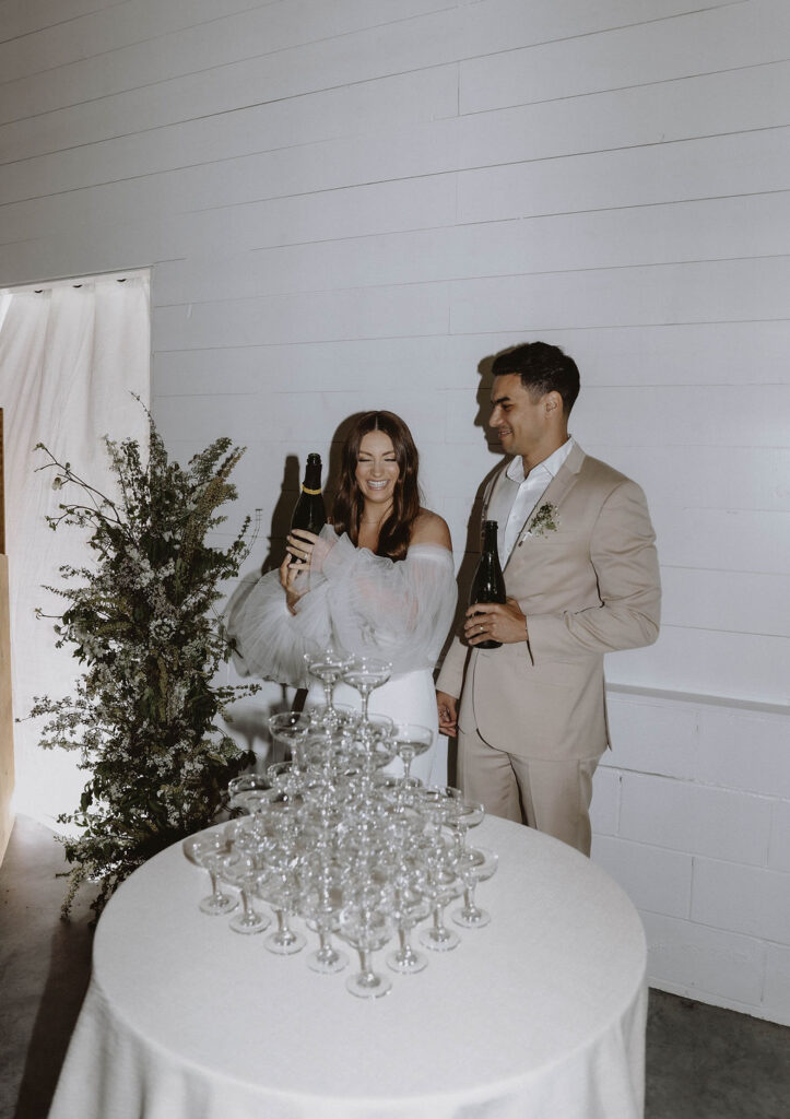 couple doing a champagne tower