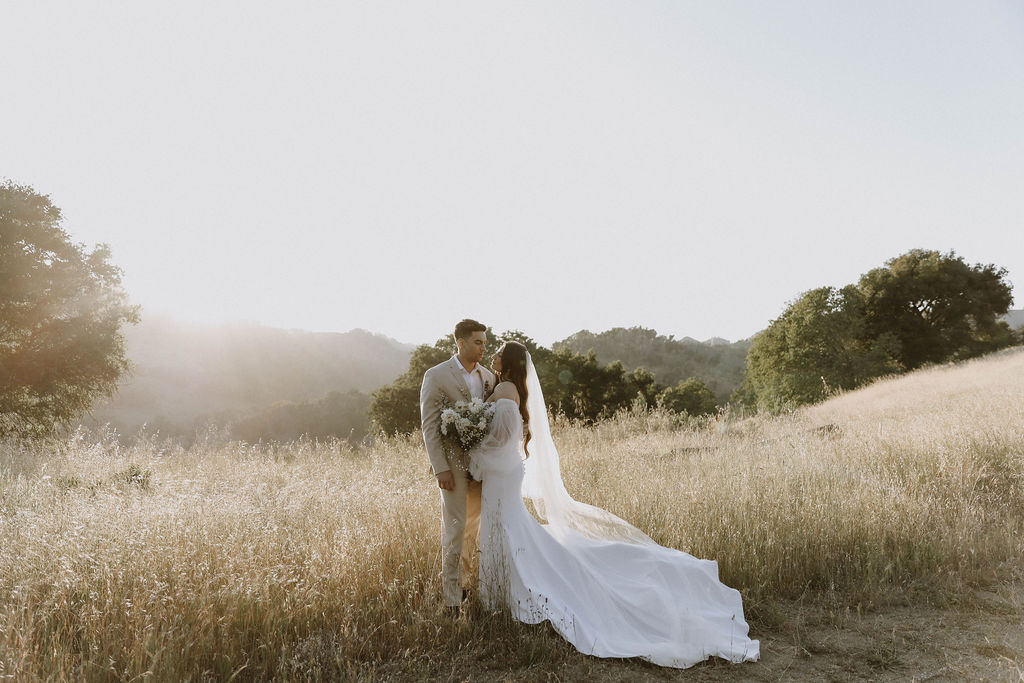 West Event Co | Sonoma County Wedding Planner | bride and groom looking at each other with the sun in the background