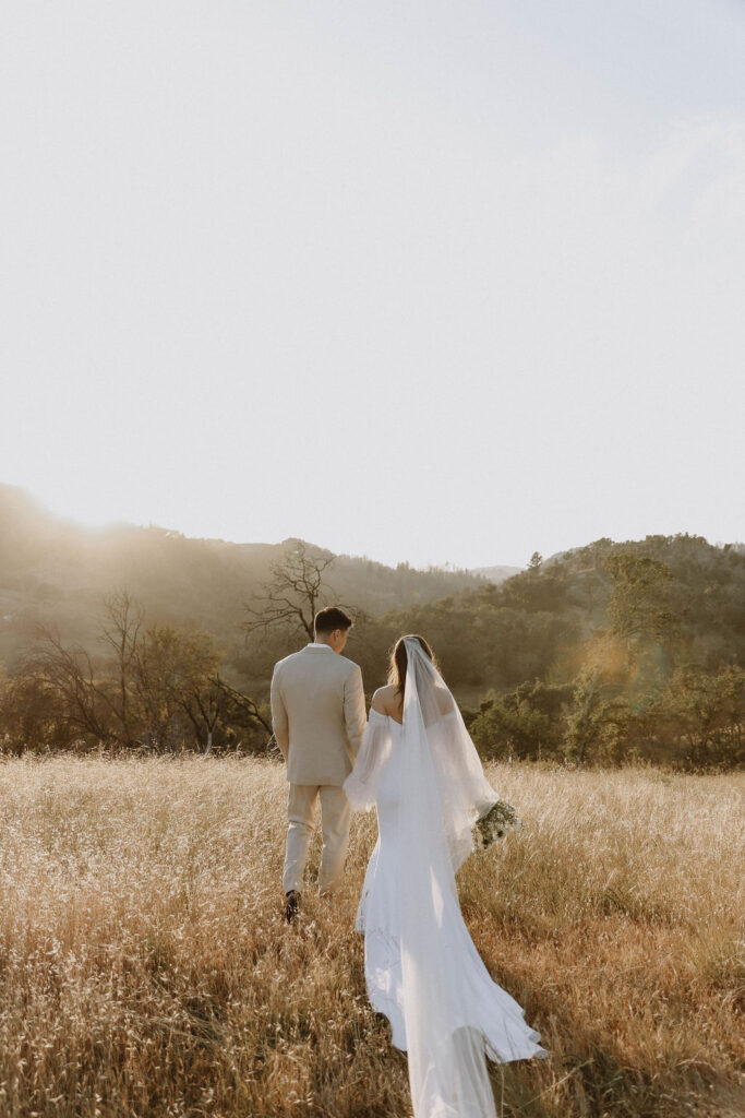 West Event Co | Sonoma County Wedding Planner | couple walking holding hands 